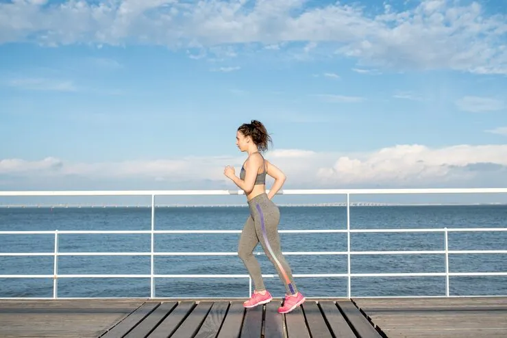 beautiful-sporty-woman-jogging-bridge_1262-5977.jpg