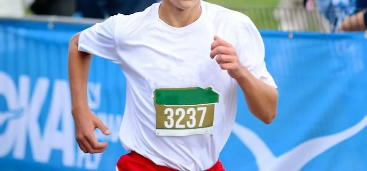 close-up-high-school-cross-country-runner-finishing-race-wearing-bib-his-jersey_1296531-816.jpg